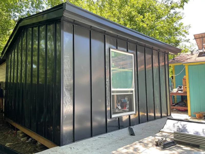 Black standing seam metal wall panels for Roof Inspection in Alpine